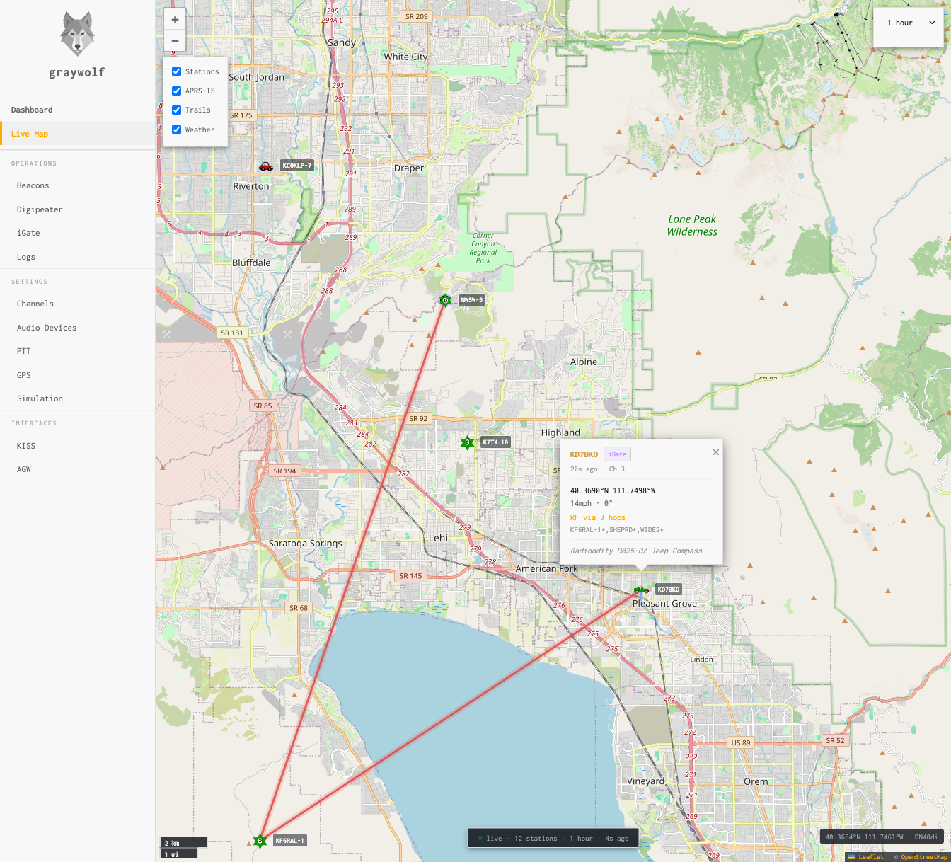 Live Map showing APRS stations with callsign labels, trails, and weather overlays on an OpenStreetMap base